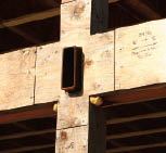 The projects from the western face of the house, attached to the steel posts by welded butt connections.

