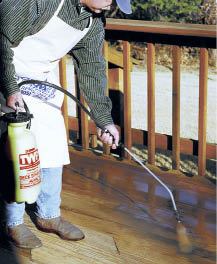 Tips on FinishingStart with a sprayer. Most deck professionals agree that applying finishes with a sprayer is best. It provides ultimate control and allows for an even coat. It also puts finishes in difficult-to-reach areas. But don't stop there. Back brush the spray, or better yet, use a sponge-pad applicator to push stain deeper into the wood. Photo by TWP.Whether you're refinishing boards that have already been coated or starting from scratch, a clean, open-pored surface is the key to getting the most protection and life out of any finish. Best practices include using kiln-dried wood and coating every exposed surface of the board. Sealing all parts of the board reduces the potential for cupping, especially on surfaces where snow and water will sit for long periods of time.Use a mild detergent to clean wood that has already been sealed. Deck cleaners offered by finish companies are formulated to be gentle on the wood's lignin, which bleach and water will damage. Remove any existing stain with a stripper. Depending on the level of grayness, brightener may restore the wood's original color. Lightly sand to remove mill glaze from new wood and UV-damaged fibers from old wood.Apply finish to clean, dry wood that's free of dirt, mildew, and debris. Follow the manufacturer's recommendations for surface and air temperature.Be sure that the product you're using is appropriate for the substrate. Hardwoods often require a penetrating finish.When sealing new pressure-treated wood, follow the wood preserver's guidelines. Some pressure-treated wood contains water repellent and may need exposure to the elements before it will take a finish.Most finishes can be applied by brush, pad, or sprayer. Professional finishers often spray and then either back brush or use a sponge pad. Spraying provides even coverage, and back-brushing works the finish into the grain. Sponge-pad applicators push the product even deeper into the wood.Follow the manufacturer's instructions carefully. Some products are explicitly formulated to be applied only as a single coat, others require two coats. Applying more coats than recommended will create a film that is likely to peel. Also follow the product guidelines for drying time between coats; a second coat applied too soon won't penetrate evenly and may not dry at all.