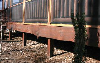 Figure 1. Keeping the tops of footings just below grade makes the support posts look like they grew from the ground.