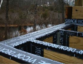 Figure 7. Even treated lumber is susceptible to rot if water is allowed to accumulate or to enter cracks. Covering the tops of joists and beams with peel and stick avoids this problem.