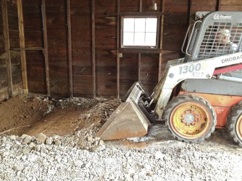 When the author’s crew demoed the garage’s existing 2-inch-thick slab, they discovered that the walls were bearing on cinder blocks placed on their side, with the existing slab keyed into the voids.