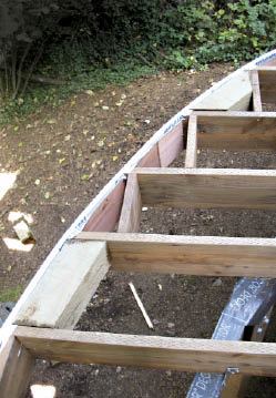 Figure 11. Flashing keeps water out of the fascia layers, and solid blocking prepares the frame to receive top-mounted railing posts.