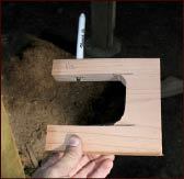 Figure 14. The author built a U-shaped jig to transfer the elliptical shape from the fascia to the decking. As he moved the jig around the perimeter of the deck with its bottom arm bearing on the curved fascia, the marker inserted in the top arm drew a matching curve on the top of the decking.