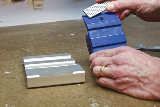 Powerful magnets anchor the interchangeable diamond stones to the wings of the carriage.