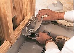 The dam corner is pressed into the sealant.