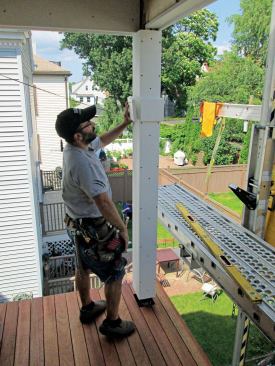 Installing bases. I install the bases by slipping the pre-assembled part of the base around the post and then screwing and gluing the final side in place. Once the base is complete, I just slide it down to the porch floor and screw it to the sleeve on all four sides.