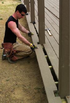 Figure 8. The last board always requires notching. Drill the corners of the holes first, then use a jigsaw to cut out the notches.