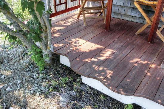 My customer wanted to increase the width of her 3-foot- wide porch by more than a foot, plus add a wavy outer edge that would meander around a large Rose O’Sharon shrub and mimic the winding curves of her cottage garden