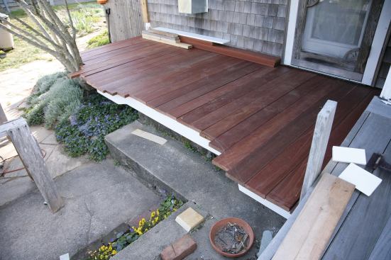 When I returned, she had drawn the whimsical pattern she wanted without any meddling from me. We refined the curve on either side of the steps for a smooth transition, and I stacked the boards for installation.