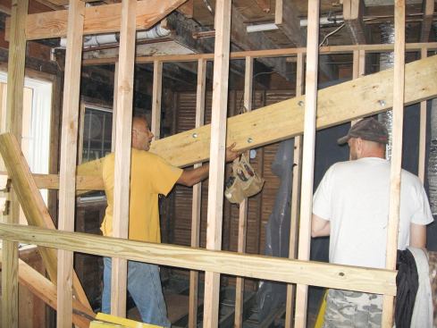 To open up the new eating area, they also replaced an old dropped header with a new flitch beam, first cutting back the joist ends. . . .