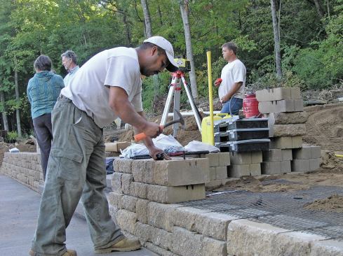 Some manufacturers use pins to align the blocks in their segmental retaining walls. Versa-Lok’s pin system ensures that each course has a 3/4-inch setback, giving the wall face an angle of about 7 degrees away from vertical.