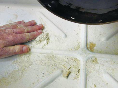 BEFORE YOU PACK UP YOUR SAW

Cutting tile with a wet saw generates a lot of fine particles that get circulated by the coolant pump along with the water. If these particles build up over time, they can shorten the life of the pump (30), so the catch basin should be cleaned regularly. Run the pump in a bucket of clean water to rinse it out after each use (31).