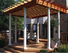 Creative Outdoor Wood Products included a retractable shade system and white fiberglass columns for a distinctive look, above.
