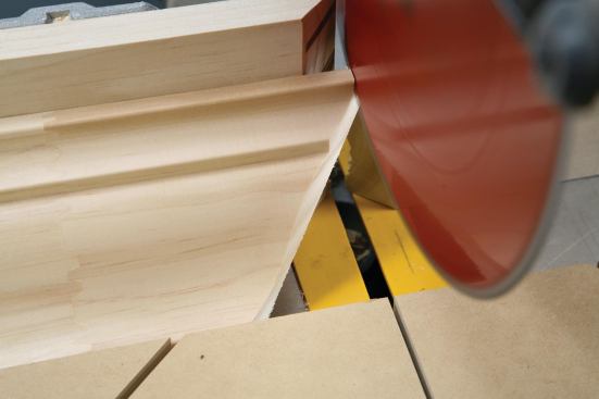 the author cuts off the tip before removing the piece from the saw.