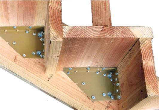 A bracket made by EZ Stairs can reinforce the attachment of rail posts to stair stringers.