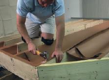 RainEscape’s brown polyethylene fabric drains into a proprietary gutter system.