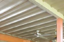 DrySpace’s V-shaped vinyl panels hang from ledgers that are fastened and taped to the sides of the joists.