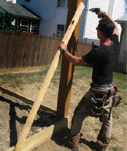 Bracing the posts to the box not only keeps them plumb, it stabilizes the assembly and makes it safer to climb on during construction.
