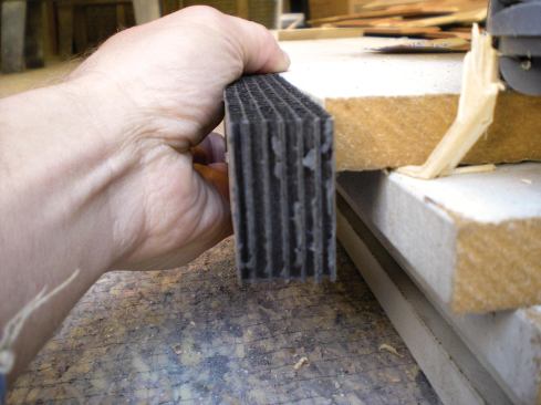 Neither aluminum strip vents nor perforated fiber-cement panels would have looked quite right, so we tried Cor-a-Vent S-400 (cor-a-vent.com) corrugated polypropylene strip vents to our soffit assembly.