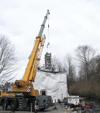 Encased in a custom-made steel enclosure, the reinforced statue was plucked from the site by crane and placed in storage for a couple of months. Later, the same rigging and hauling contractor, Shaughnessy and Ahern of Boston, would ease the figure into the museum through a skylight.