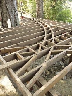 Figure 3. Blocking parallel to the joists for the long inlay on the upper deck was relatively simple (above), but blocking the curved section on the lower deck took a lot of layout and numerous individually cut pieces (below).