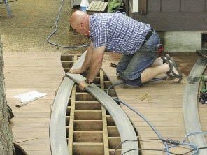 Figure 5. The curved decking of the inlay was used as a pattern to mark the field decking for cutting. Then, the curved pieces were laid in place and marked for cutting from below.
