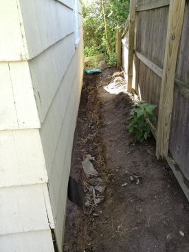 A teardown would have prompted the relocation of the new garage some 9 feet further into an already-small yard to accommodate the town’s side-setback requirement of 12 feet.