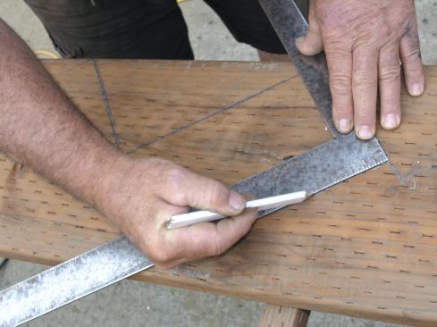Lay out the bottom riser cut, then mark the cut on the bottom of the jack so the riser is one tread thickness shorter than all the others.