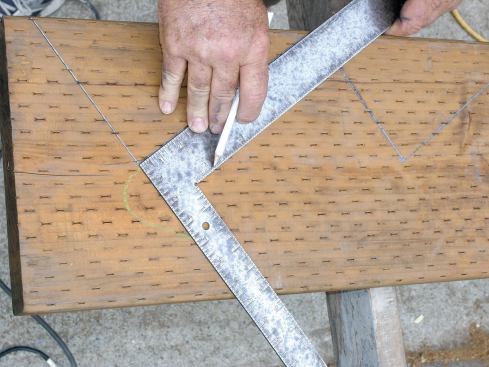 Mark the top cut on the stringer square down from the top tread.