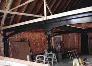 The author replaced the existing steel I-beam and supporting column with a framework of custom-fabricated decorative steel.
