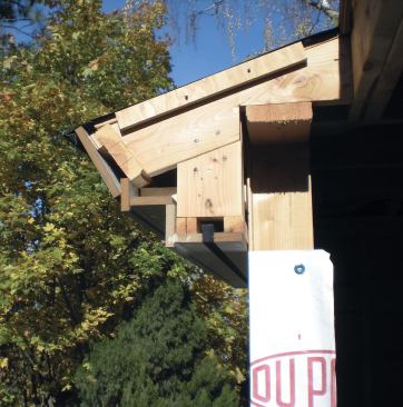 We first added ripped 2x2s to the bottom of our framed eaves assembly.