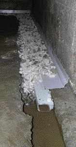 The job described here required the two-piece version because the footing prevented placing the pipe against the wall.