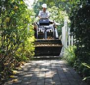 Figure 3. Deck builders often work in backyards with limited access. If the path is wide enough for walking, odds are a subcompact loader can get through.