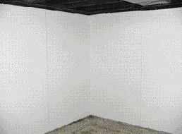 Many customers opt to finish the basement walls with white fiberglass-reinforced panels, a big improvement over the moldy masonry typically found in wet basements.