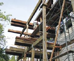 Once all the beams were placed, bundles of joists were craned into position. One end of the bundles rested on the beams, the other on temporary supports built next to the house.