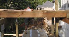 The author rolled the joists into position while standing on the scaffolding.
