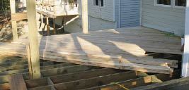 The 2x6 decking was face-screwed at a 45-degree angle to the house and framing both for appearance and to prevent lateral sway.