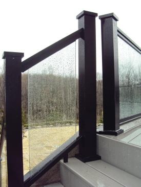 Glass railings preserve views but require cleaning.	