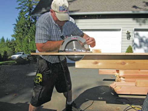 Using his jig as a guide, the author roughs out the curve with a 10-inch circular saw. 
