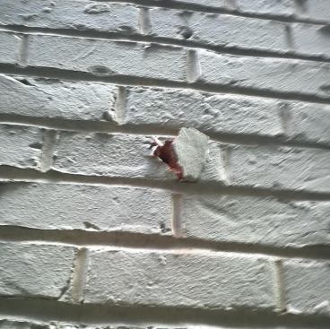 Fortunately, the brick was soft enough that the bit tended to emerge cleanly on the outside.