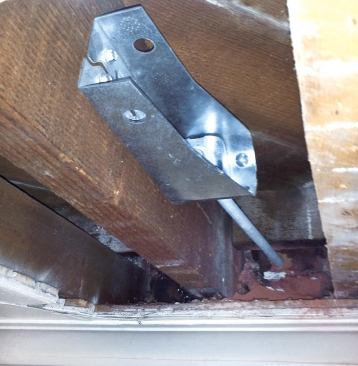 We secured the inboard ends of the rods to Simpson HDU2 hold-downs attached to the ends of the joists.