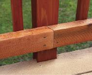 Figure 2. The guardrail posts anchor to the outside of the rim joists, so only one course of decking had to be notched at the rims. Installing the decking from the rim toward the house placed a full-width board above the rim for easy notching and attachment