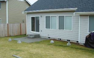 Figure 1. A featureless backyard with no real entertaining space can be easily improved by the addition of a deck.