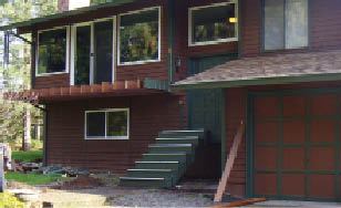 Figure 7. The old entry to this split level was uninviting. On the upper deck, the ends of unsheltered cantilevered joists were rotting.