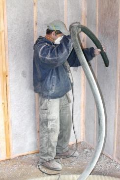 Wall cavities are filled first from the bottom to the midpoint of the wall.