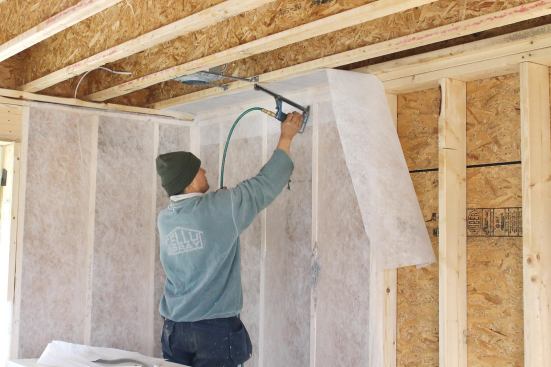 A strip of netting between a top-plate nailer and the facing joist makes it possible to dense-pack this area of the band joist.