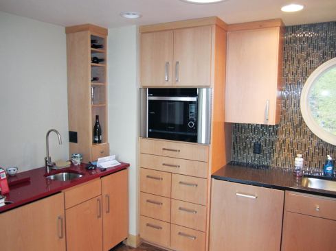 The microwave and pantry base cabinets were also so large that it took four men to carry them into the house, even after we had removed the doors and drawers. The integral toekicks compounded the problem. I generally ask cabinet­makers to provide separate bases and kicks — it’s easier to level a 10-pound toekick than a 150-pound base cabinet.