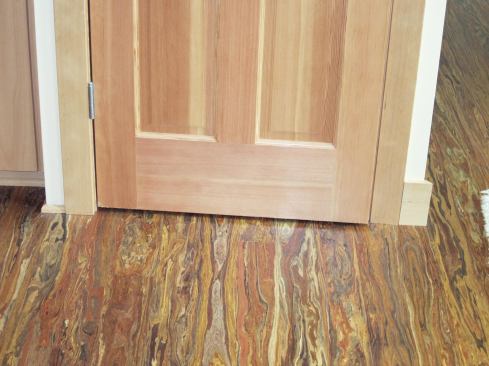 The pantry unit has a rotating inner shelf that spins only if the door is opened beyond a certain angle. Unfortunately, the 5-inch fir baseboard used everywhere else in the kitchen got in the way here.