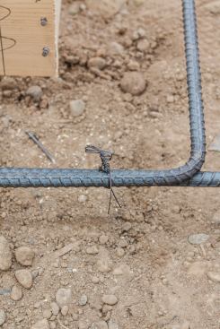 Each tie is exactly the same — three wraps of wire twisted into what looks like a neat little bow.