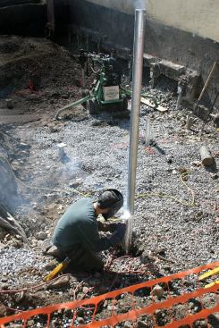 Shaft extensions are welded on and the pier driven as deep as needed to reach soil with adequate bearing capacity.